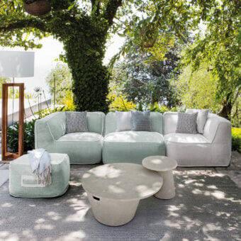 Exceptional Atmosphera Soft Modular Sofa with light green technical fabric and gray-white cushions creating a gently curved silhouette