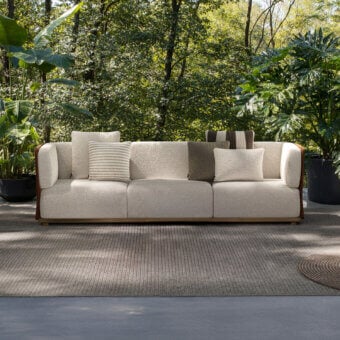 Sophisticated Atmosphera Switch sofa with neutral off-white textile upholstery and satin-finish wood frame
