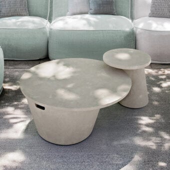 Distinguished Atmosphera Totem coffee table exhibiting a tactile concrete finish with a neutral gray tone and asymmetric cylindrical base