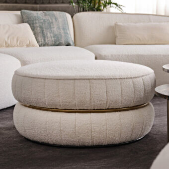 Exceptional Black Tie Lillo ottoman with creamy bouclé textile upholstery and slender metal ring, crafted with ribbed stitching