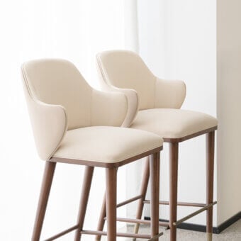 Distinctive Capital Diva stool crafted with light beige textile upholstery and warm medium-brown wood with a satin finish
