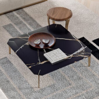 Captivating Capital Eclectic coffee table with black marble tabletop and sleek gold-toned metal legs
