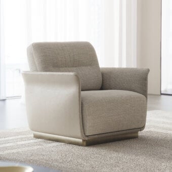 Elegant Capital Mon Allure lounge chair with warm gray textile upholstery and creamy beige leather accents built on a metal plinth