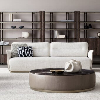 Refined Capital Mon Allure sofa with neutral beige textile and sleek metal-finished plinth base exhibiting a subtly textured matte finish