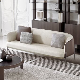 Refined Capital Oxford sofa upholstered in smooth beige textile with quilted leather, built with a slender light-toned metal base and contrasting cushions