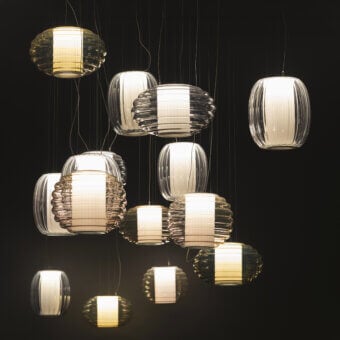 Distinguished Contardi Alma suspension lamp crafted in blown glass with a pleated fabric diffuser and matte white band
