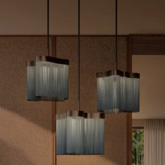 Elegant Contardi Arcipelago suspension lamp with a bronze body and fire-resistant Trevira CS fringes, crafted in silver-grey metallic chains with dark brown wood