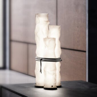 Exceptional Contardi Baggy Trio table lamp crafted in double-satin polycarbonate with a dark gray textile cord exhibiting organic tiers