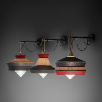 Elegant Contardi Calypso Wall Lamp featuring tiered shades in dark gray and red with warm wood and a matte metal arm