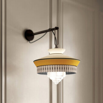 Superior Contardi Calypso Wall Lamp lighting with a dark-toned metal arm and shade in warm yellow and white geometric patterns