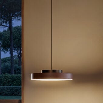 Distinguished Contardi Discus suspension lamp crafted with metal and textured leather-like material in a warm reddish-brown finish