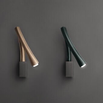 Distinguished Contardi Flexiled wall lamp with a flexible brass arm covered in tan double-side stitched leather and matte gray metal base
