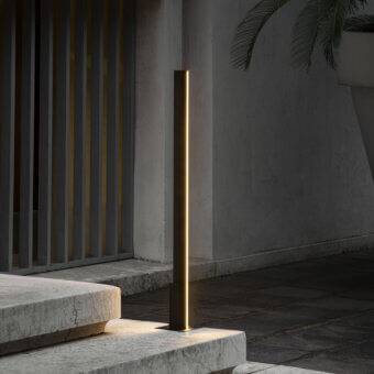 Distinguished Contardi Fly Outdoor floor lamp crafted in dark gray metal with a matte finish emitting a warm vertical glow