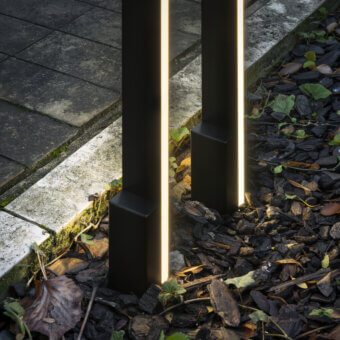 Elegant Contardi Fly Outdoor floor lamp crafted in matte black metal with integrated strip LED modules emitting warm light