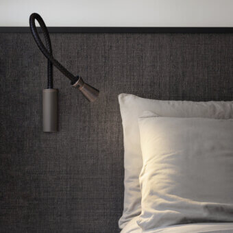Elegant Contardi G+T wall lamp crafted in brass with a woven leather flexible arm and dark bronze matte finish