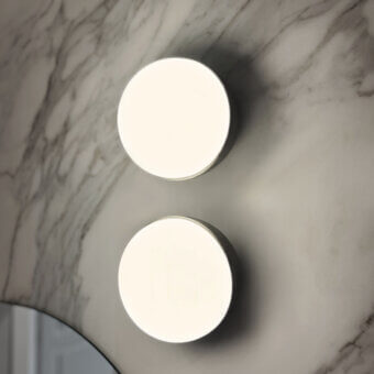 Distinctive Contardi Kiki wall lamp crafted in Italy with satin metal and white opal glass delivering balanced illumination