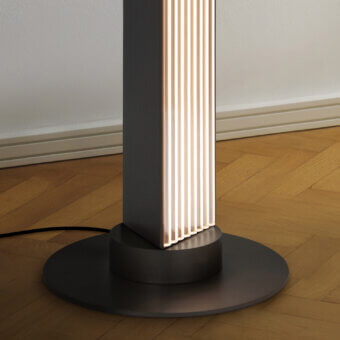 Elegant Contardi Stick floor lamp with sleek dark gray metal and skillfully modulated ribbed glass diffuser