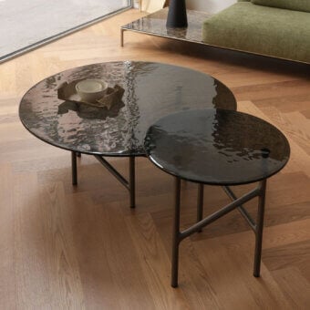 Distinguished Horm Alexander coffee table with dark gray matte metal base and beautifully hammered glass top