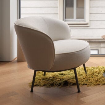 Exceptional Horm Concorde lounge chair with textured light beige textile and slender dark-toned metal legs