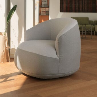 Distinguished Horm Edith swivel lounge chair with sculpted textile shell and light gray finish embodies contemporary Italian craftsmanship
