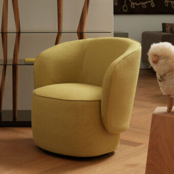 Superior Horm Étoile swivel lounge chair with calibrated volumes upholstered in textured woven textile and matte golden yellow finish