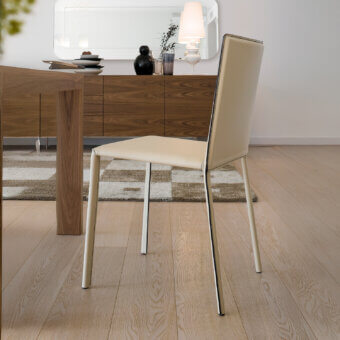Elegant Ivano Antonello Italia Luna chair in creamy beige leather with a satin-finished steel frame and curved backrest