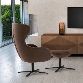 Exceptional Ivano Antonello Italia Madame lounge chair crafted in medium brown satin wood with geometric recessed paneling