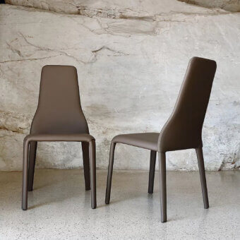 Superior Ivano Antonello Italia Olivia dining chair in warm brown leather with a gently curved silhouette and satin finish