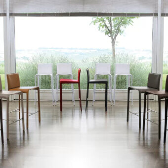 Distinctive Ivano Antonello Italia Rey stool with molded seat and sleek metal base in a striking red hue with satin finish