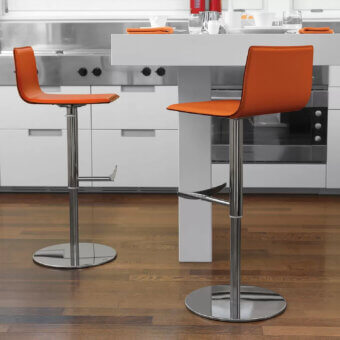 Distinctive Ivano Antonello Italia Roby bar stool in vibrant orange leatherette with a polished steel frame