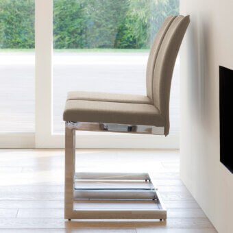 Architectural Ivano Antonello Italia Sonia dining chair with light tan textile upholstery and polished steel frame