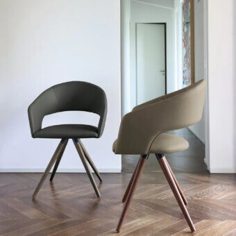 Distinctive Ivano Antonello Italia Arena armchair with muted olive green fabric and lacquered solid wood legs