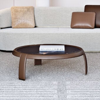 Distinguished Capital Omega coffee table with dark marble tabletop and reddish-brown curved wooden legs