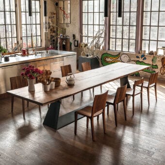 Distinguished Riva 1920 Bedrock Plank table crafted with a monumental warm medium-brown solid wood tabletop and sculptural dark gray metal base