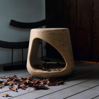 Captivating Riva 1920 Geppo stool carved from scented Cedar of Lebanon wood with sinuous lines and a smooth matte finish