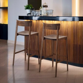 Exceptional Riva 1920 Mia bar stool crafted in medium brown solid wood with a satin finish