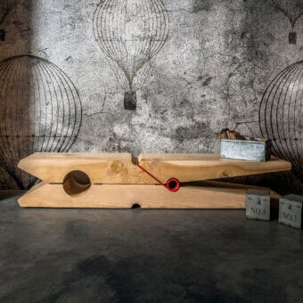 Superior Riva 1920 Molletta bench carved in solid Lebanese cedar wood with a matte finish and contrasting metal spring detail