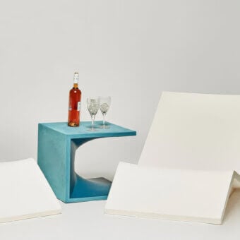Superior Serralunga Aquaplano side table in teal blue recyclable plastic with a sleek matte finish and geometric cutouts