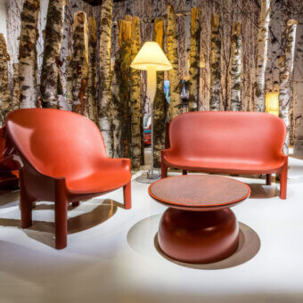 Superior Serralunga Balzac sofa with a distinctive curved form crafted in reddish-orange LLDPE with a matte finish