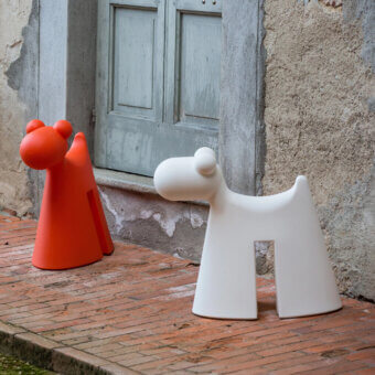 Distinctive Serralunga Doggy sculpture stool in vibrant orange LLDPE with a smooth matte finish