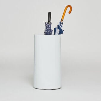 Distinguished Serralunga Giano umbrella stand with cylindrical form in muted gray-white recyclable LLDPE and matte finish