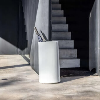 Avant-garde Serralunga Giano umbrella stand with tall cylindrical form in matte white recyclable LLDPE material