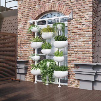 Elegant Serralunga Greenpills vertical planter crafted in recyclable LLDPE with a glossy white finish