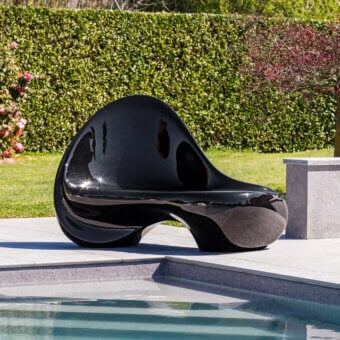 Captivating Serralunga Ripple sofa sculpted from durable LLDPE with a glossy black lacquered finish offering a fluid form