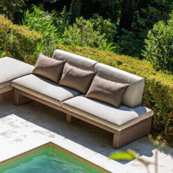 Superior Serralunga Riviera sofa built in matte brown LLDPE with light gray textured cushions for all-weather lounging