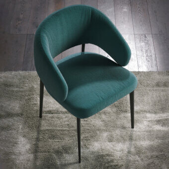 Exceptional Tonin Casa Astra armchair with softly curved silhouette upholstered in textured deep teal fabric and painted metal base