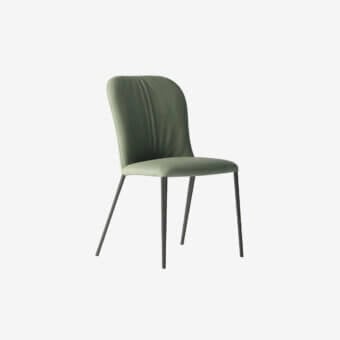 Sophisticated Tonin Casa Bustier chair with muted green fabric upholstery and lacquered dark metal frame