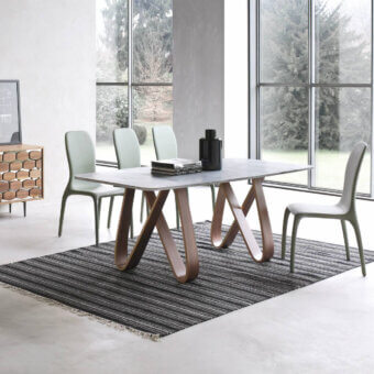 Distinguished Tonin Casa Butterfly table crafted in stone composite with a warm medium-brown wood base and satin finish