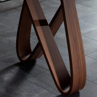 Captivating Tonin Casa Butterfly table crafted in medium-dark brown wood with a satin finish and graceful looping legs