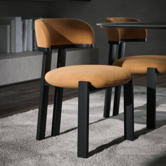 Distinguished Tonin Casa Camila chair with inviting golden-yellow textile upholstery and dark matte solid wood frame